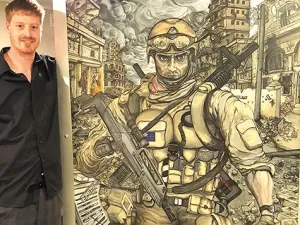 Joe Ashwell poses with his work