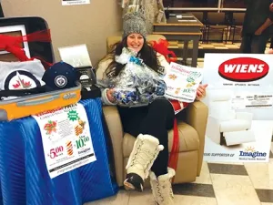 Raffle winner Mel Bergen arrives to claim her prizes