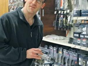 Ryan Becenko stocking shelves at Wm. Dyck and Sons