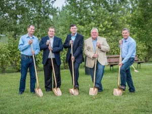 Shannon Martin, Kerry Church, Myron Dyck, Clarence Braun, and Ted Falk at the splash pad sod-turning