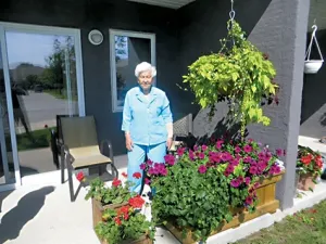 Margaret Stott shows off her patio garden
