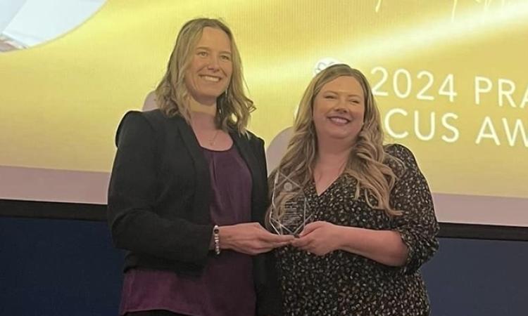 Chantel Todd receives her award from Courtney Bangert-Murray, president of Recreation Manitoba.
