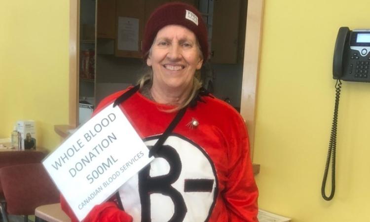 Holly Rafferty makes her one hundredth blood donation at Canadian Blood Services.