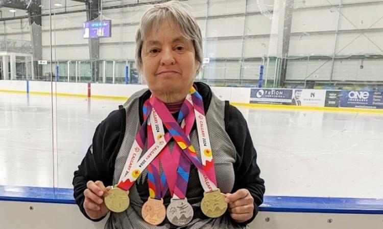 Terrylinn Johnson shows off her most recent medals.