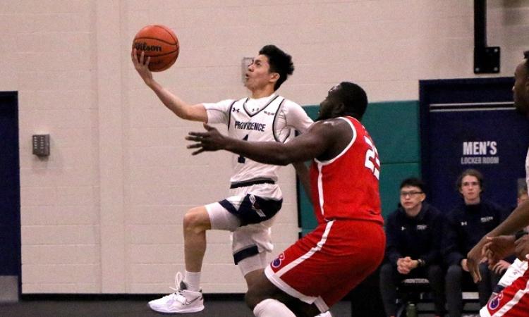 The men's basketball team on home turf at Niverville's CRRC.