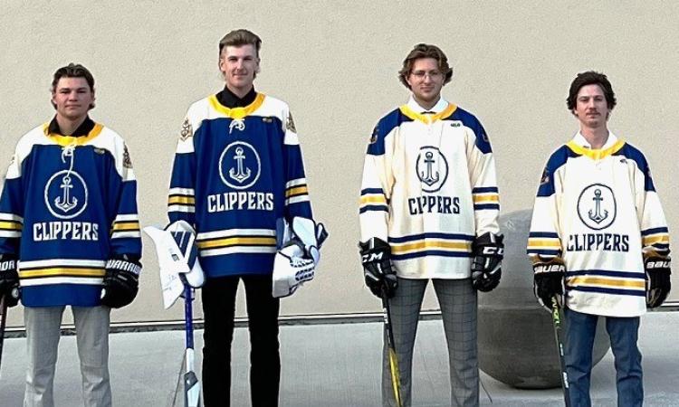 Junior C Clippers players Elijah Durksen, Nathan Rempel, Jaxsen Friesen, and Ethan Fehr show off this season's new jerseys.
