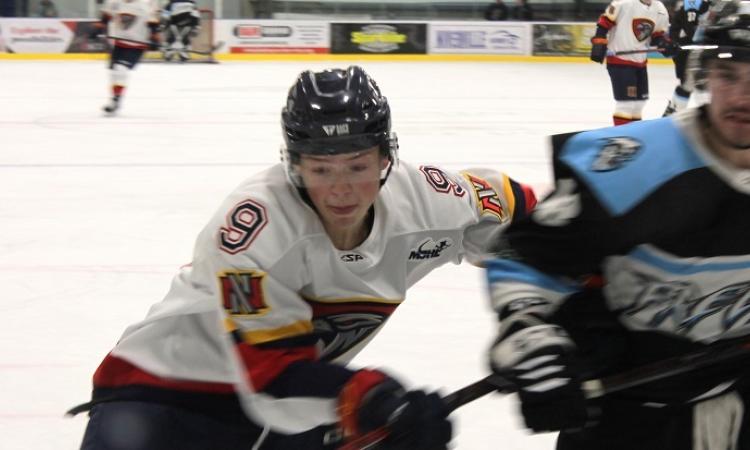 Defenceman Ethan Kelly goes to the boards during the Nighthawks' 6-0 victory against the Winnipeg Freeze.