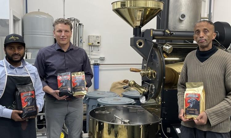 Henok Gebre, Ray Dowse, and Adam Hashi with the new Nighthawks-branded coffee.