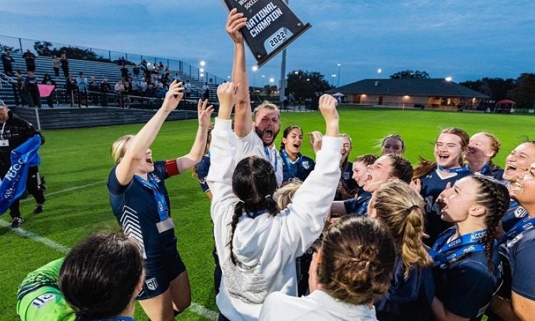 The Providence Pilots women's soccer team celebrate winning the NCCAA national championship.