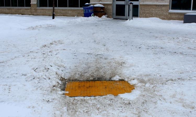 The tacile pads in front of the CRRC in Niverville. (Understandably, the pads are under a lot of snow these days...)