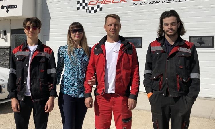 Dmitry, Victoria, and Pavel Petrenko, along with service technician Pascal.