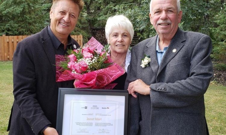 MLA Ron Schuler with Jeannot Robert and his wife Yvonne.