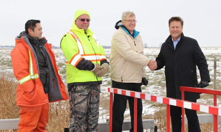 Last November, two provincial employees along with Deputy Mayor John Funk and MLA Ron Schuler meet outside Niverville.