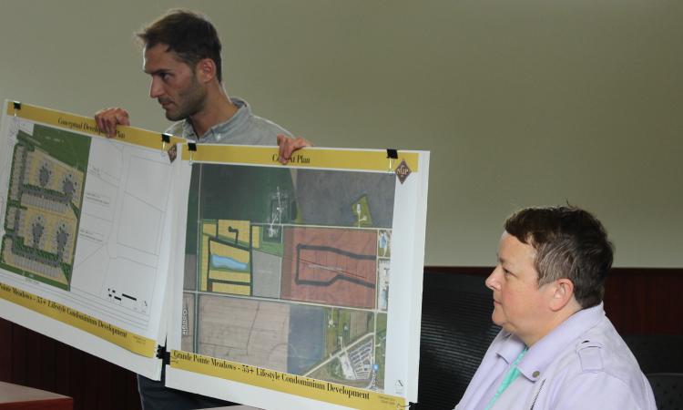 Jackie Wilkie and an associate of McGowan Russel Group present their conceptual drawings to council.