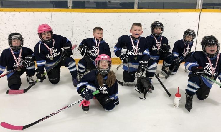 Landon Friesen, Mia Maloney, Brody Burke, Jacey Rae Dorcht, Zachary Boone, Sawyer Kroeker, Braylin Gray, and Asher Funk of the Clippers Initiation White team.