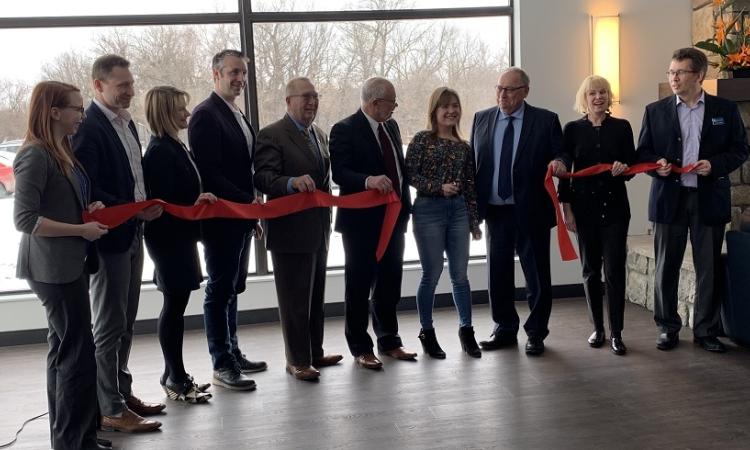 Officials gather to mark the opening of Muriel Taylor Hall.