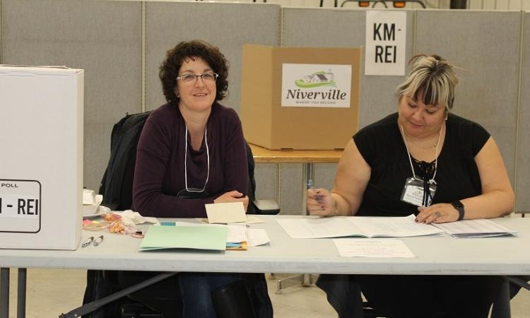 Poll workers at the Niverville town office on Tuesday.
