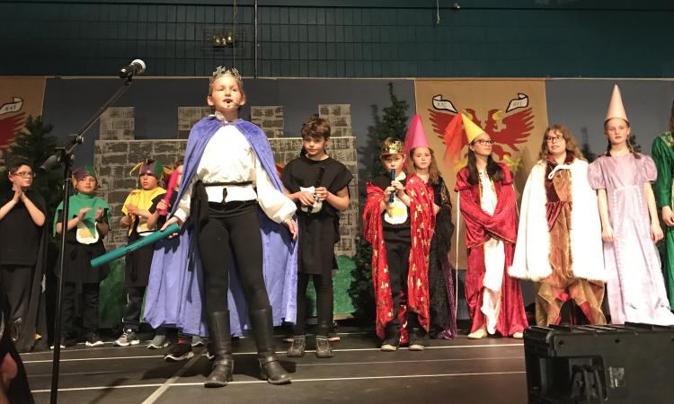 Class 4P at NES performing on the evening of May 1.