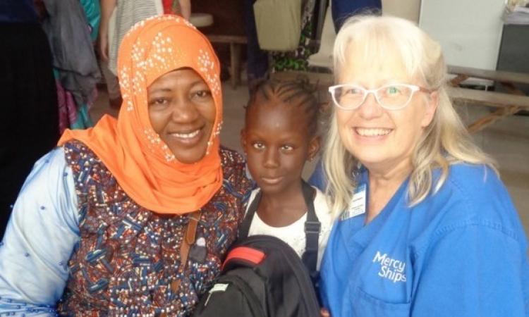 Laura Klassen with a patient and her mother while on a medical mission in Africa.