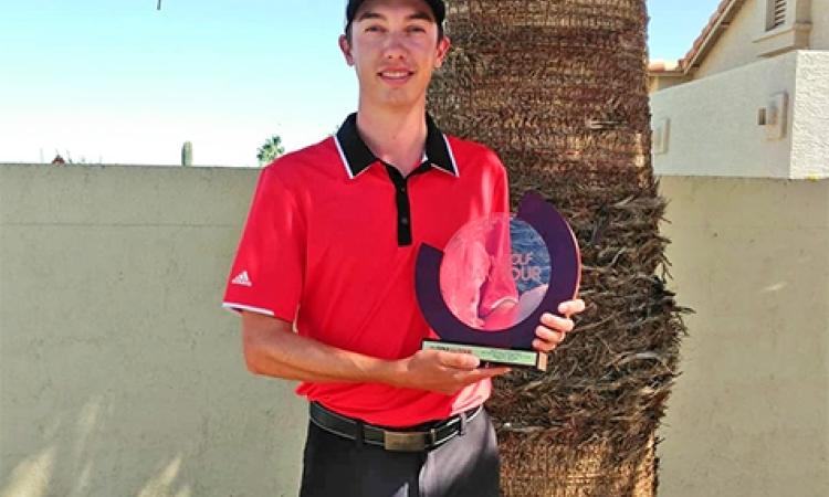 Colwyn Abgrall displays his trophy from the Golf Channel AM Tour event at Ak-Chin Southern Dunes in Arizona.