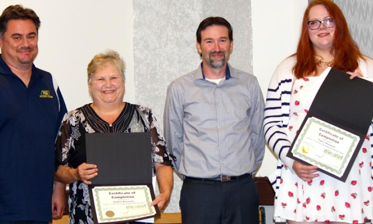 John Magri of the Niverville Chamber of Commerce alongside graduates Deb Brissette, Dave Smith, and Taylor Hayward.