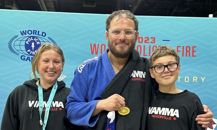 Jens Reuter with his kids at the World Police and Fire Games in 2023, where he won gold in his division in jiujitsu.