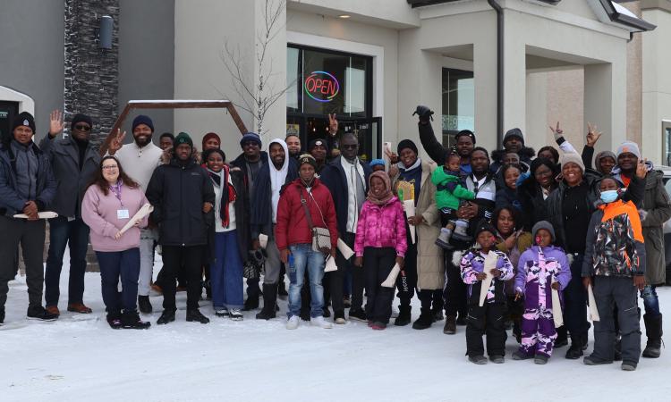A group of new French-speaking immigrants from Africa take a tour of Île-des-Chênes.