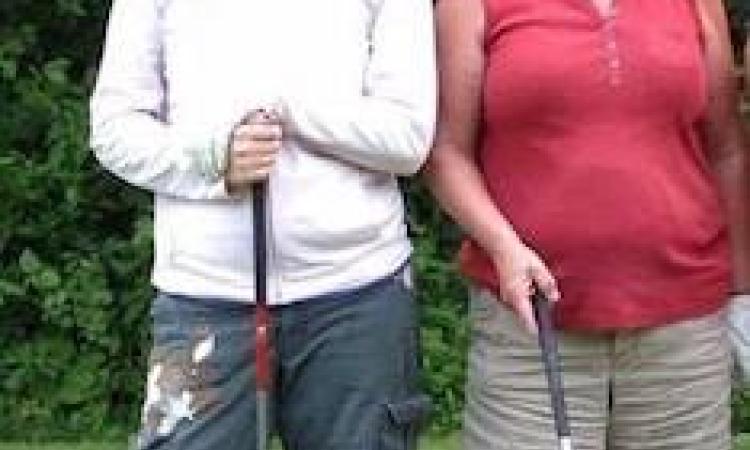 Carol Dyck and daughter Kelly Friesen celebrate her hole-in-one