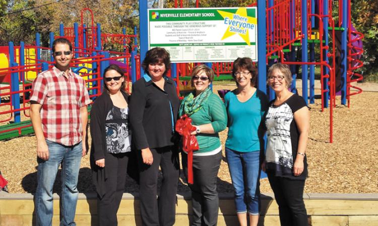 Members of the NES Play Structure Committee at the structure's ribbon-cutting a few years ago