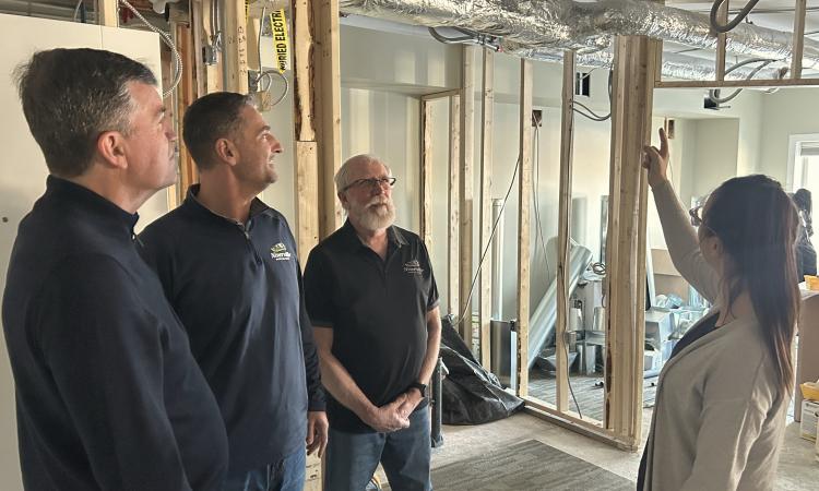 Mayor Myron Dyck, Councillor Nathan Dueck, and Deputy Mayor Chris Wiebe tour the expansion underway at Open Health Niverville.