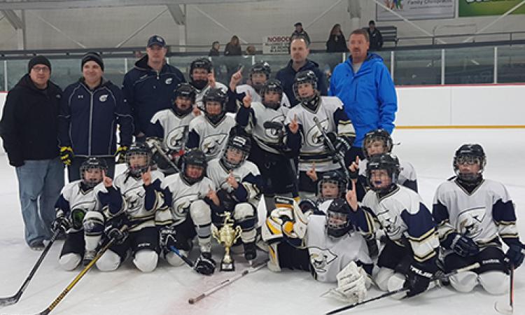 The Clippers Atom A team celebrates their victory