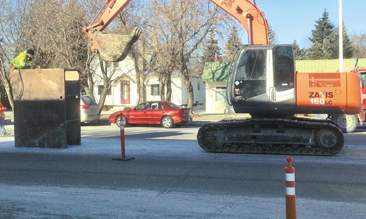 Excavation underway on Main Street to repair a sewer connecting line