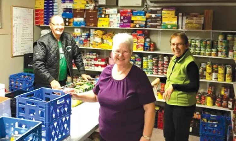 Helping Hands volunteers, Dale Toms, Mary Toms, and Irene Adams