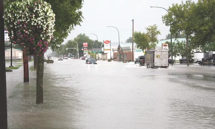 A flash flood on August 29, 2015 covers Main Street from curb to curb