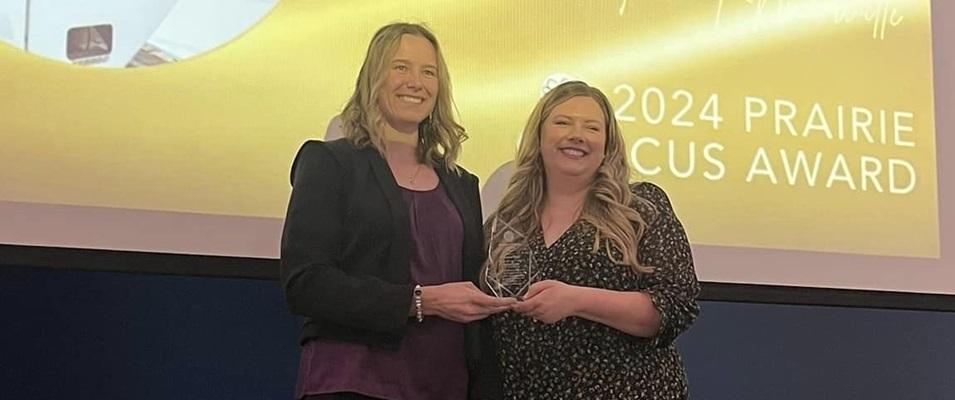 Chantel Todd receives her award from Courtney Bangert-Murray, president of Recreation Manitoba.