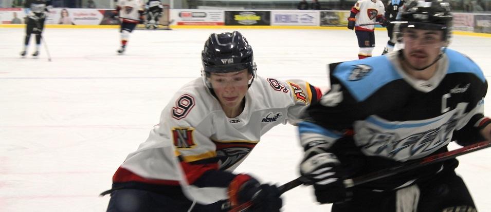 Defenceman Ethan Kelly goes to the boards during the Nighthawks' 6-0 victory against the Winnipeg Freeze.