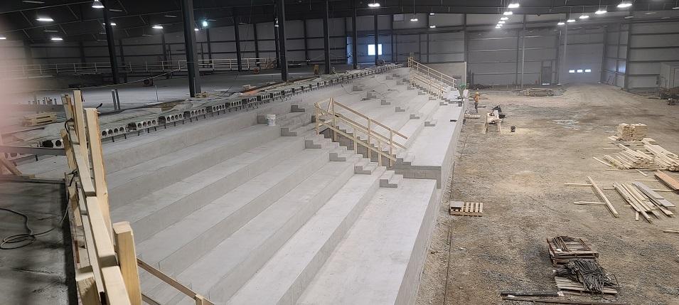 Photo 12: Long view of the arena seating arena.