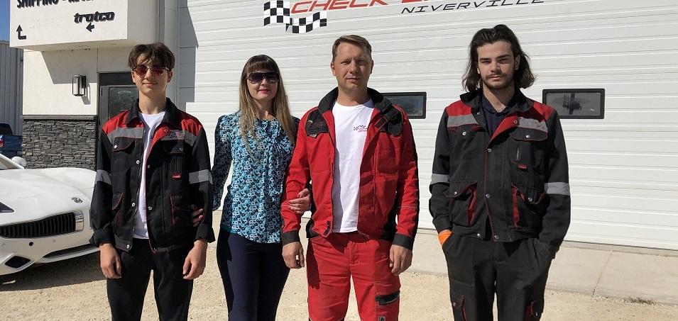 Dmitry, Victoria, and Pavel Petrenko, along with service technician Pascal.