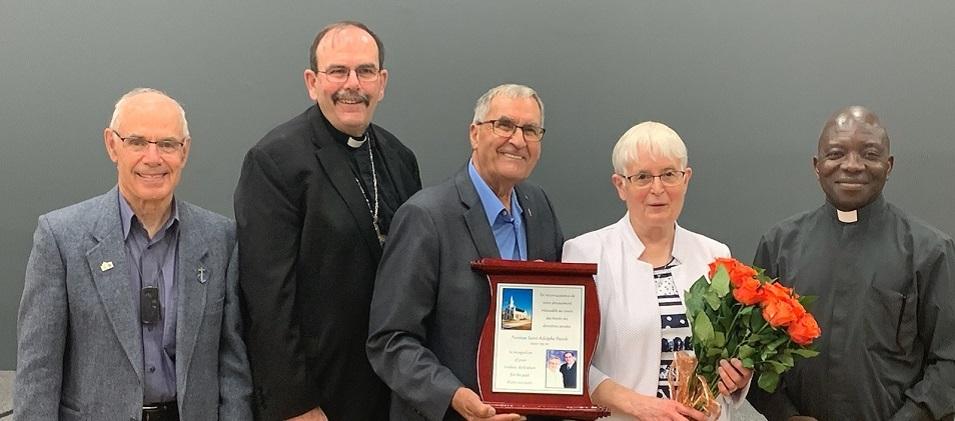 Father Gerald Michaud, Archbishop Albert LeGatt, Reginald and Ghislaine, Father Gregory Kossi Djiba.