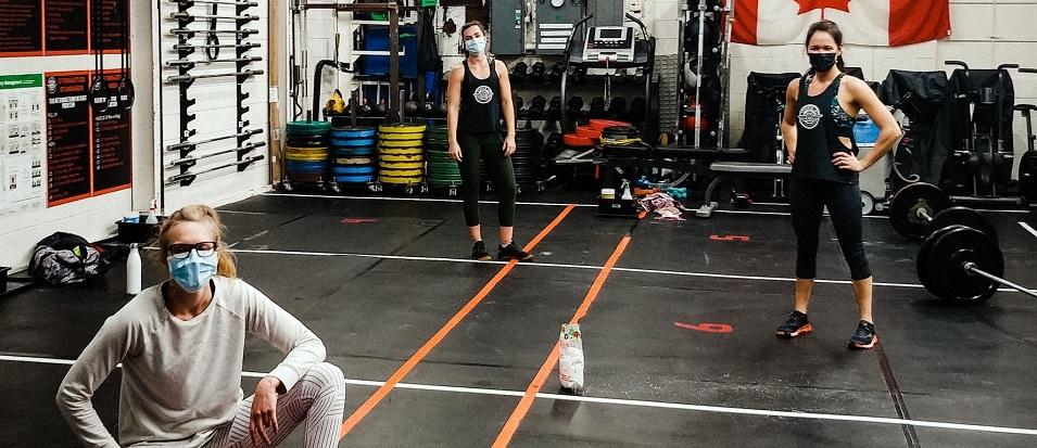 Locals Madisson Stott, Elizabeth Stott, and Aurelie Kilsdonk training at Shopgym, which is open again at 25 percent capacity.