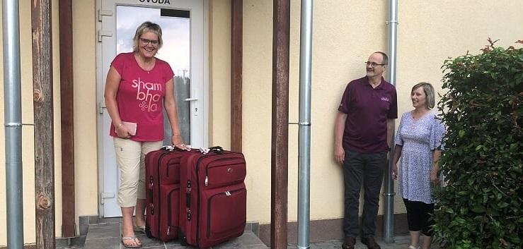 Dorothy Born at the Bodrog school, her large suitcases filled with toques and school supplies for the students. To the right: Laci Demeter, European Regional Director of ACSI, and school principal Marti Dan.
