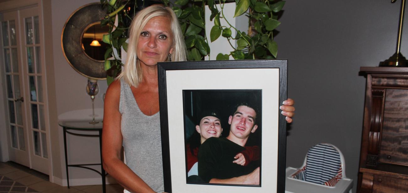 Mona Stott holds up a picture of her children, Danielle and Joey.