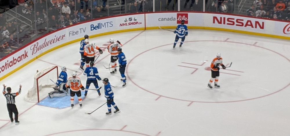 The Jets defend against the Philadelpha Flyers in December.