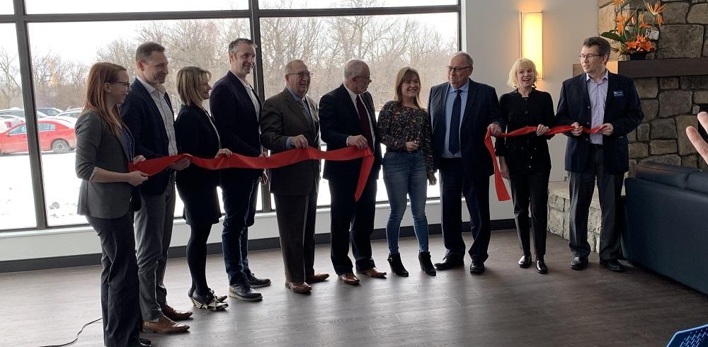 Officials gather to mark the opening of Muriel Taylor Hall.
