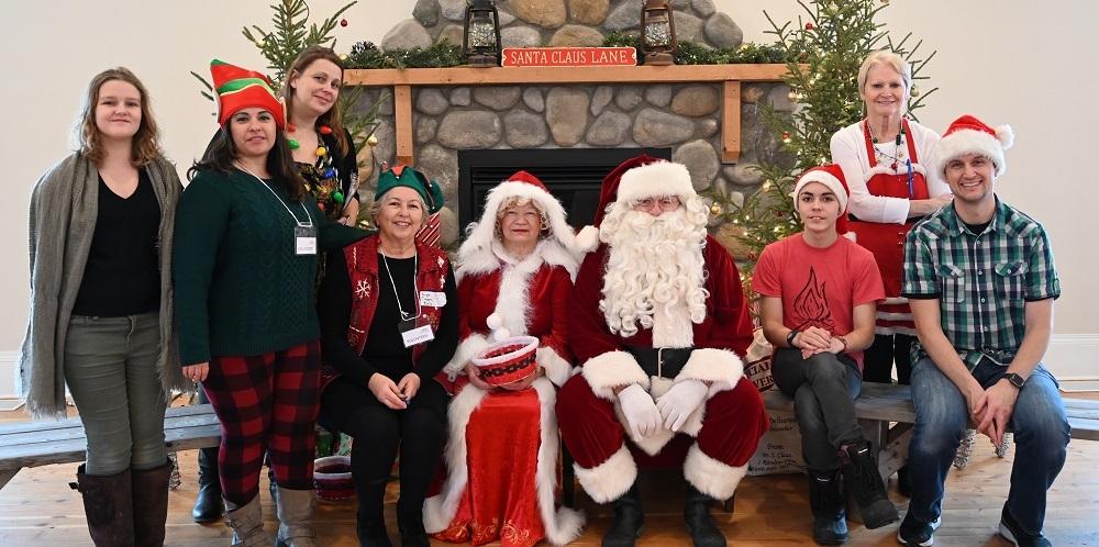 Volunteers for Christmas Town, with Mr. and Mrs. Claus.