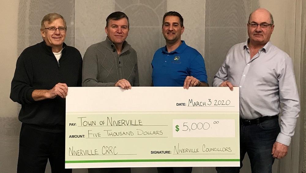 Councillor John Funk, Mayor Myron Dyck, Councillor Nathan Dueck, and Councillor Kevin Stott present their personal CRRC donation. Missing: Councillor Chris Wiebe.