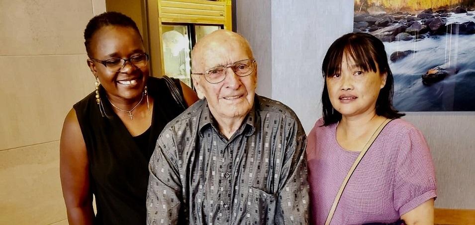 John Plett alongside PCH aides Grace and Li.