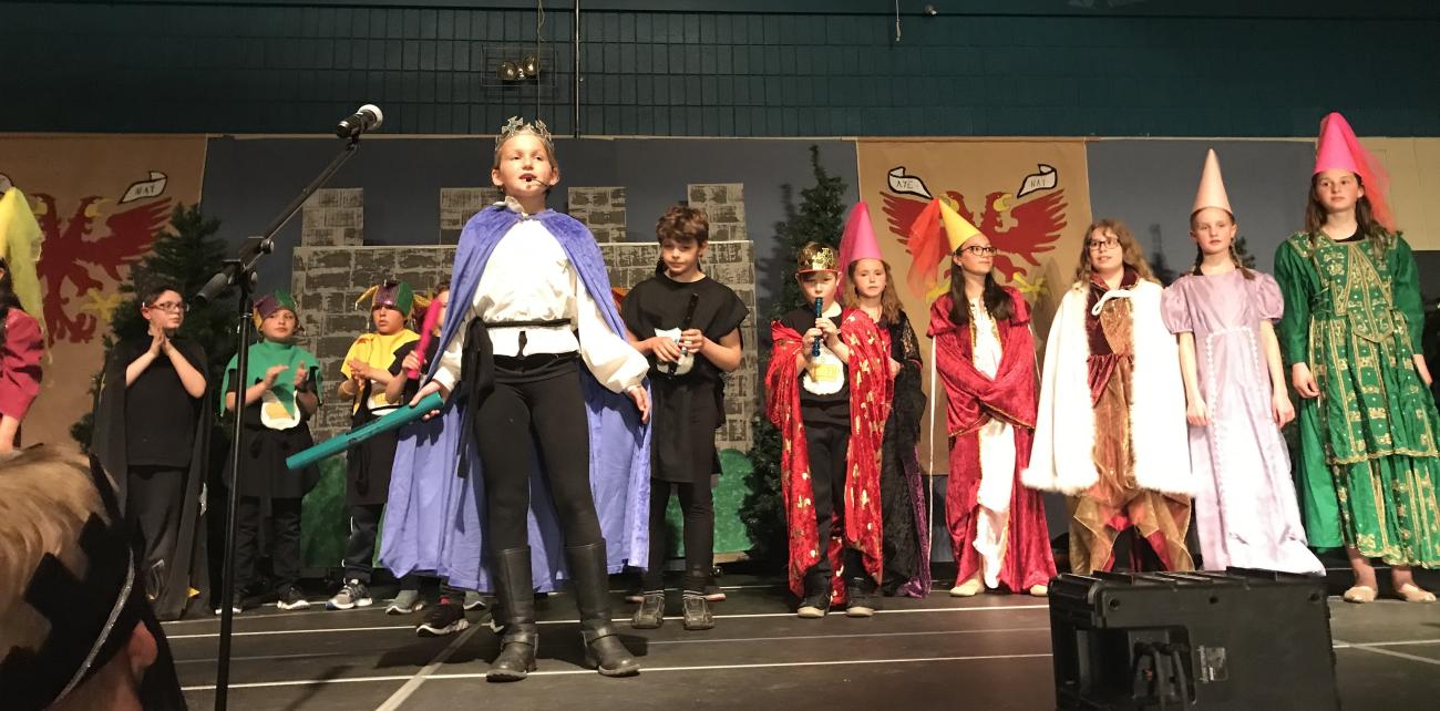 Class 4P at NES performing on the evening of May 1.