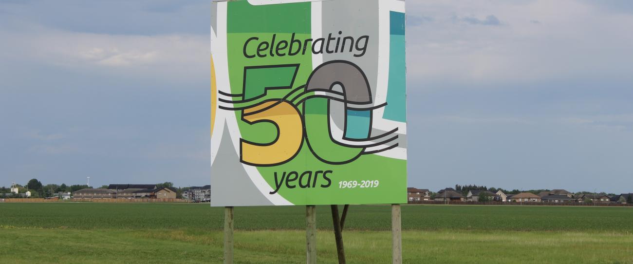 Fiftieth anniversary signs greet visitors to Niverville at either end of town.