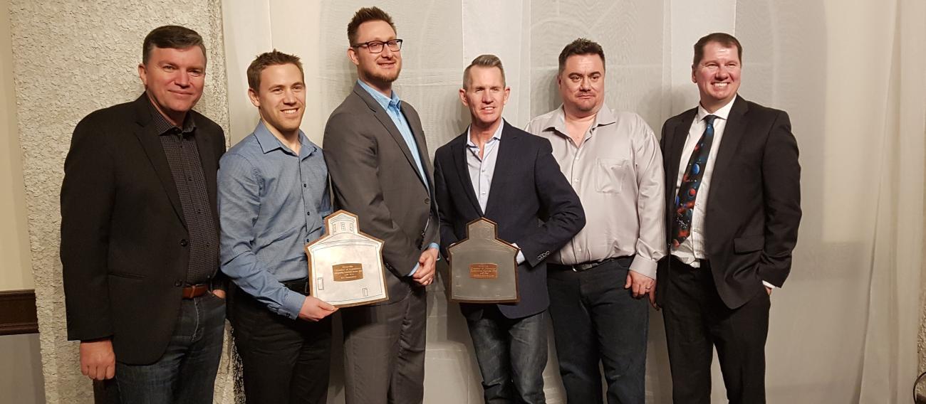 Mayor Myron Dyck, Ryan Hamm and Trevor Lux of BSI Insurance, Doug Dyck of Heritage Lane Builders, Chamber President John Magri, and MLA Shannon Martin.